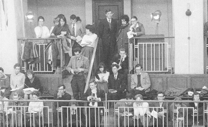 File:MU Folk D London - All at back left + 3 sat on steps.jpg