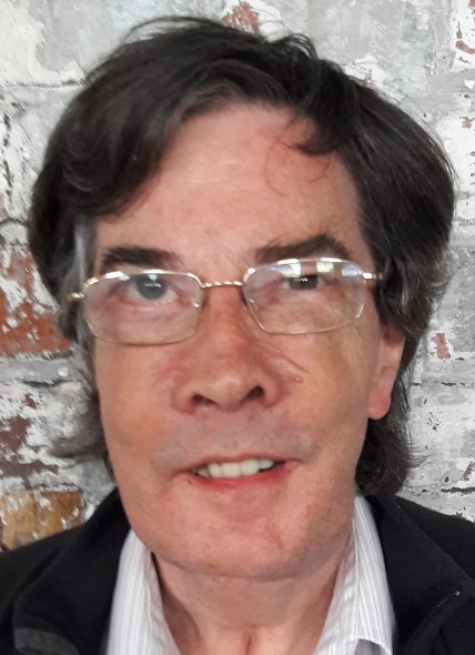 John smiling at the camera